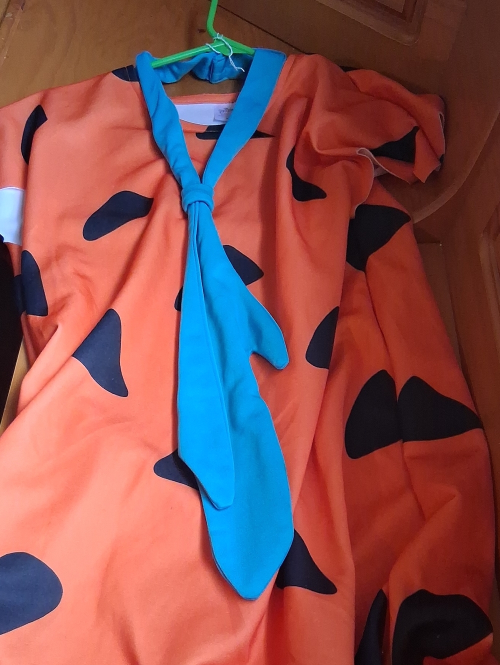 Bright Orange Dress with Black Spots and Blue Neck Tie